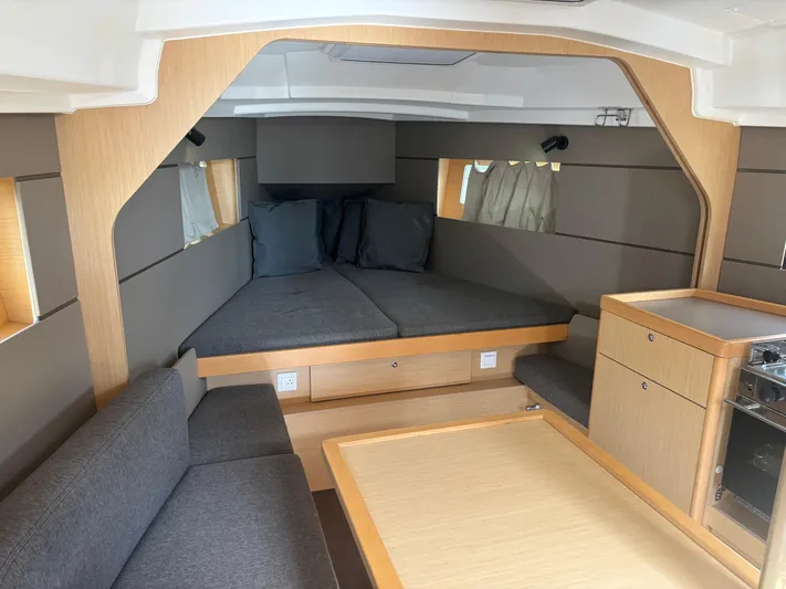 Rio Babe Yacht Photos Pics Interior of 2015 Beneteau Oceanis 35 sailboat with modern furnishings and cozy seating area.