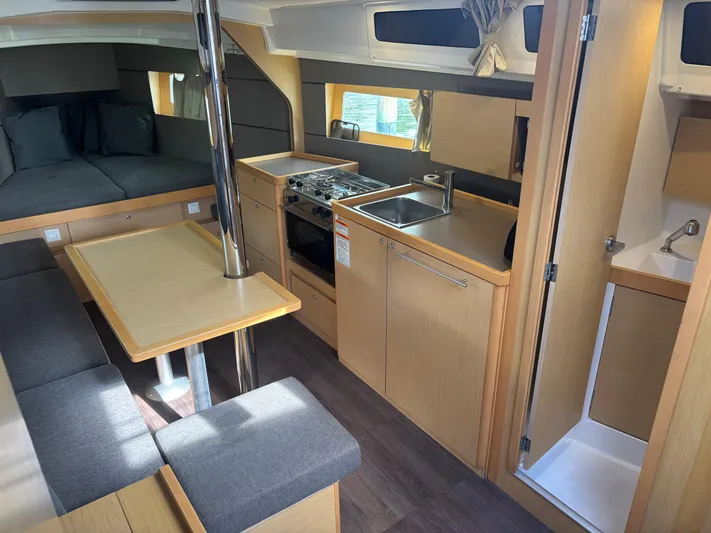 Rio Babe Yacht Photos Pics Interior of 2015 Beneteau Oceanis 35 sailboat with kitchen, seating, and sleeping area.