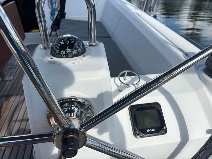 Rio Babe Yacht Photos Pics Steering wheel and compass on 2015 Beneteau Oceanis 35 sailboat deck.