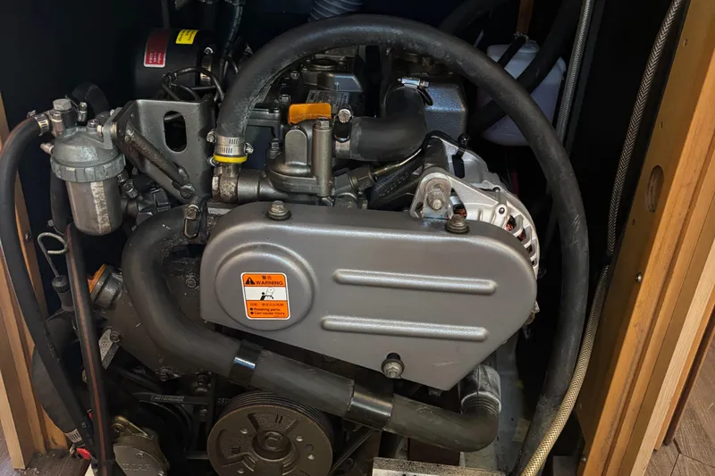 Rio Babe Yacht Photos Pics Engine compartment of a 2015 Beneteau Oceanis 35 sailboat, showcasing mechanical components.