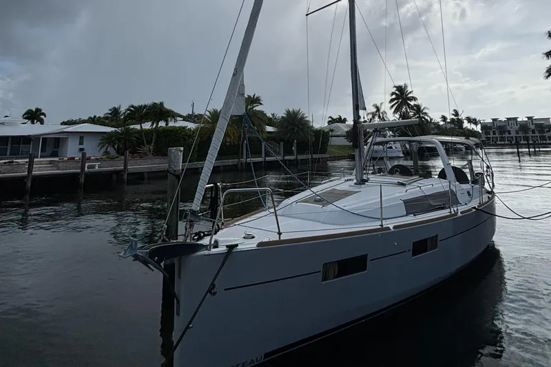 Rio Babe Yacht Photos Pics 2015 Beneteau Oceanis 35 sailboat docked in a serene marina setting.