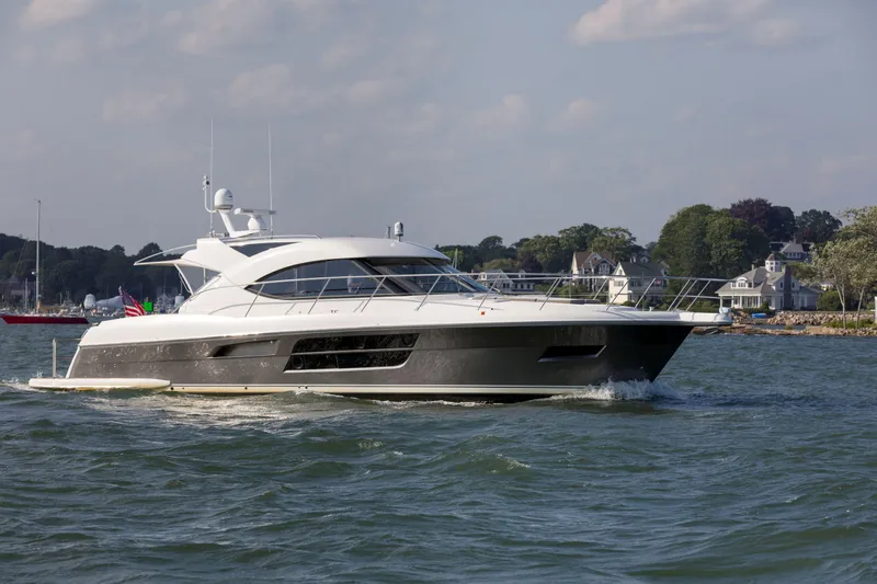 Pronto Yacht Photos Pics 2016 Riviera 5000 Sport Yacht cruising on a scenic waterway.