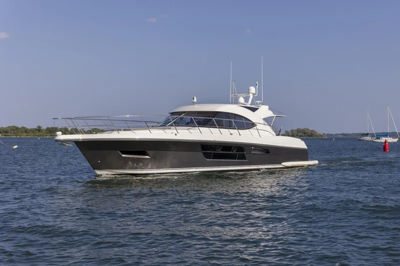 Pronto Yacht Photos Pics 2016 Riviera 5000 Sport Yacht cruising on a sunny day.