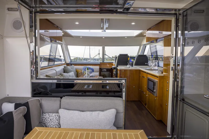 Pronto Yacht Photos Pics Luxurious interior of 2016 Riviera 5000 Sport Yacht with modern furnishings and sleek design.