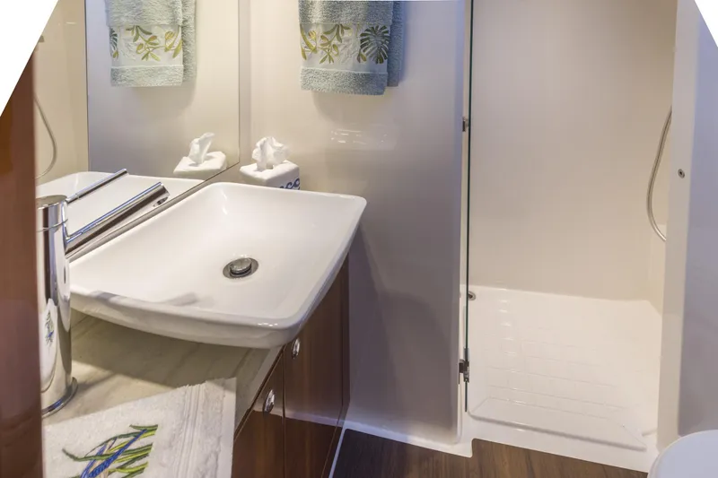 Pronto Yacht Photos Pics Luxurious bathroom in 2016 Riviera 5000 Sport Yacht with modern sink and shower.