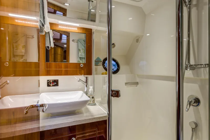 Pronto Yacht Photos Pics Luxurious bathroom in 2016 Riviera 5000 Sport Yacht with modern fixtures and elegant design.