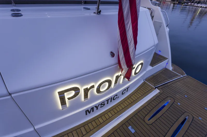 Pronto Yacht Photos Pics Riviera 5000 Sport Yacht 2016, docked with American flag, Mystic, CT.