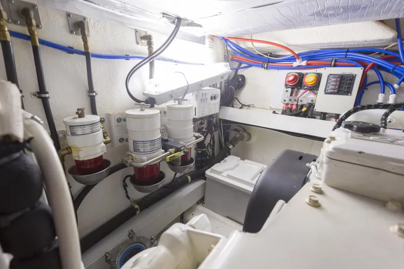 Pronto Yacht Photos Pics Engine room of 2016 Riviera 5000 Sport Yacht with fuel filters and wiring.
