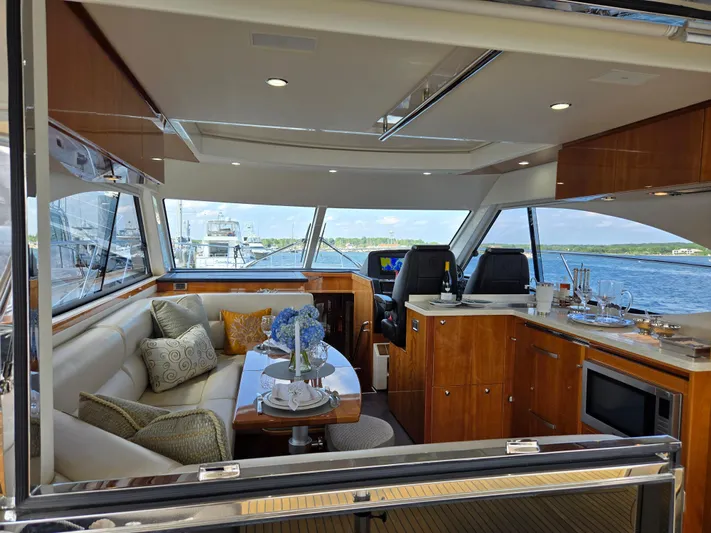 Pronto Yacht Photos Pics Luxurious interior of 2016 Riviera 5000 Sport Yacht with elegant seating and dining area.