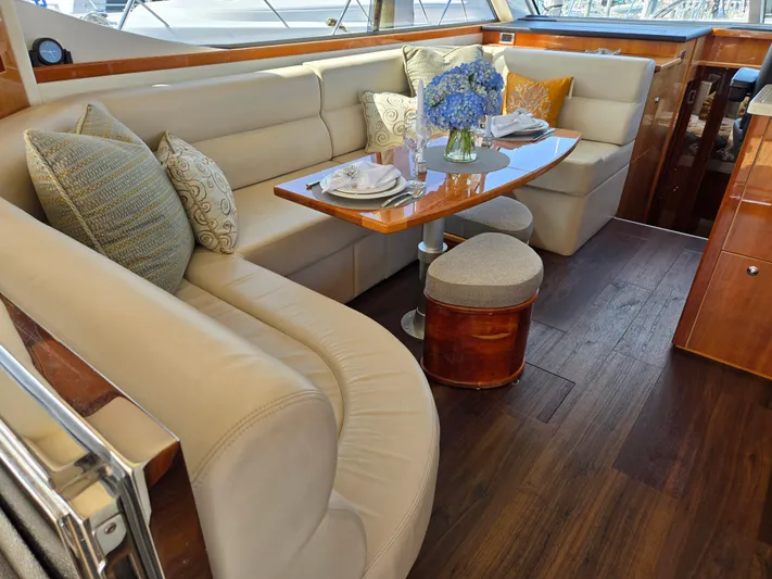 Pronto Yacht Photos Pics Luxurious interior of 2016 Riviera 5000 Sport Yacht with elegant seating and dining area.