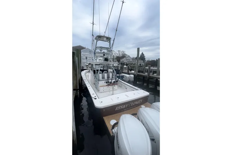No Name Yacht Photos Pics 2019 Regulator 41 boat docked, featuring multiple outboard engines and fishing equipment.