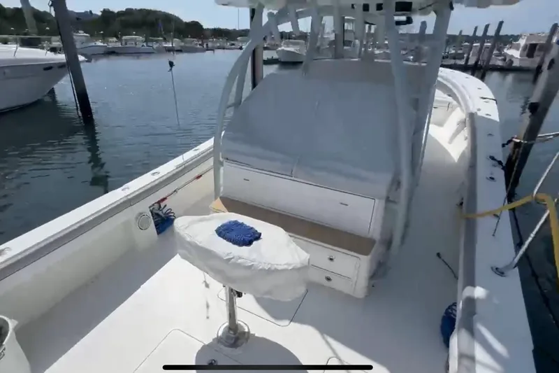 No Name Yacht Photos Pics 2019 Regulator 41 boat docked, featuring spacious deck and seating area.