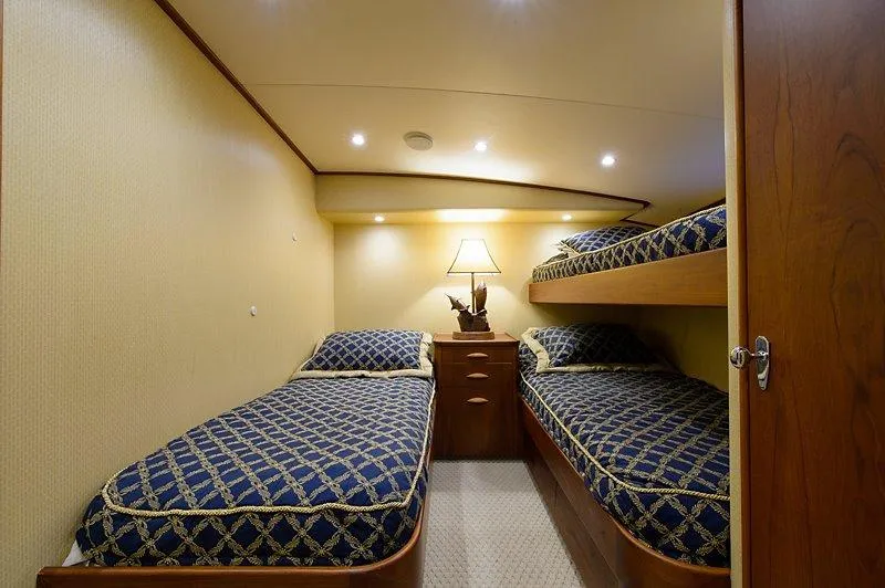 Ship's Cafe Yacht Photos Pics Interior of a 1987 Custom Carolina Merritt yacht with bunk beds.