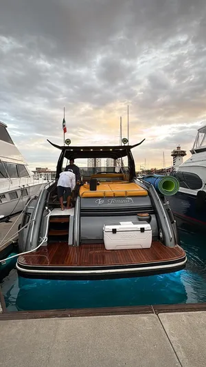  Yacht Photos Pics Sunseeker Predator 58 yacht docked at marina, 1994 model, with sunset sky backdrop.