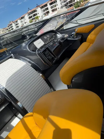  Yacht Photos Pics Interior of 1994 Sunseeker Predator 58 yacht with yellow seats and control panel.