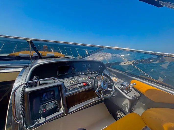  Yacht Photos Pics Cockpit of 1994 Sunseeker Predator 58 yacht with steering wheel and control panel.