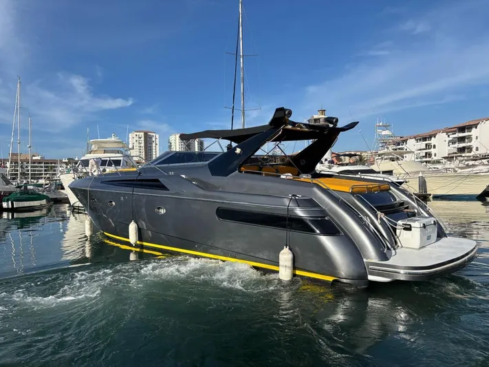  Yacht Photos Pics Sunseeker Predator 58 yacht, 1994 model, docked in a marina under clear blue skies.