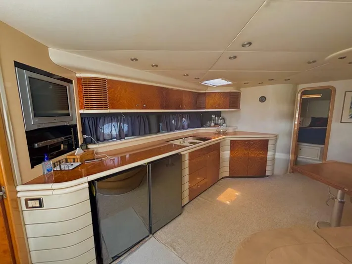  Yacht Photos Pics Luxurious interior of 1994 Sunseeker Predator 58 yacht with modern kitchen amenities.
