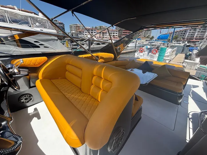  Yacht Photos Pics Luxurious 1994 Sunseeker Predator 58 yacht interior with stylish orange seating and marina view.