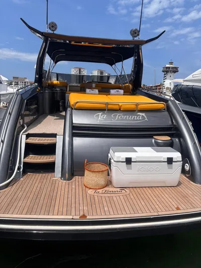  Yacht Photos Pics 1994 Sunseeker Predator 58 yacht with orange seating and cooler on deck.