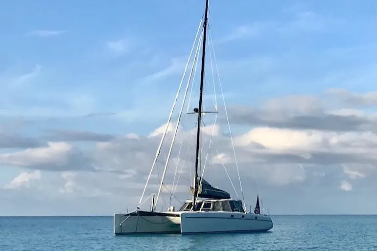 Shooting Star Yacht Photos Pics Sailing catamaran Morrelli & Melvin Shooting Star 2007 on calm ocean waters.