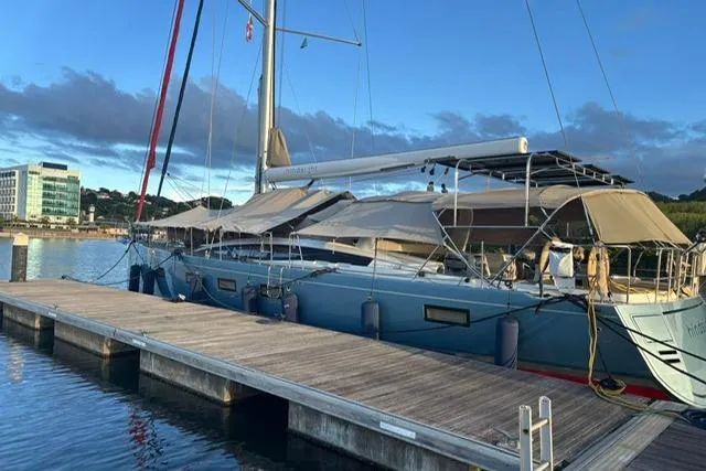 Hindsight Yacht Photos Pics 2016 Jeanneau 64 yacht docked at marina under blue sky.