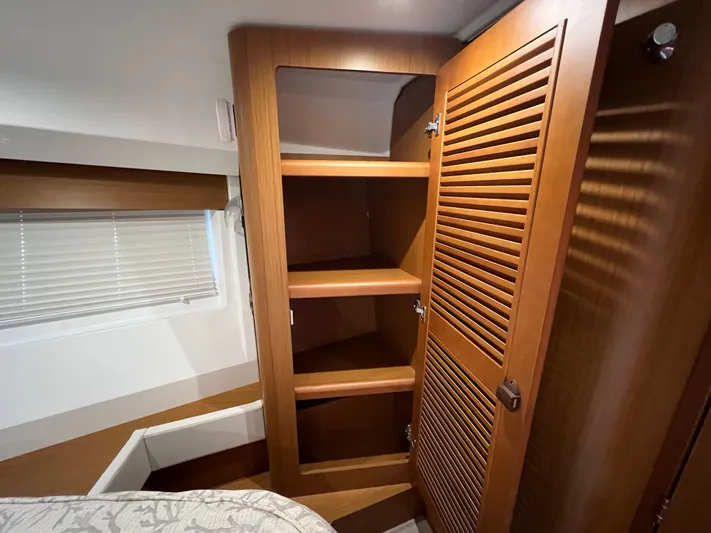 Murfey's Law Yacht Photos Pics Interior of 2020 Beneteau Swift Trawler 35 with wooden shelves and window blinds.