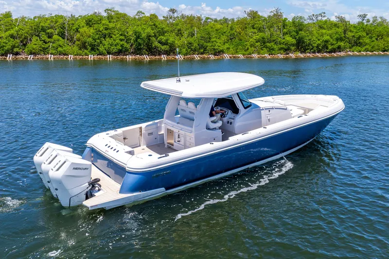  Yacht Photos Pics 2025 Intrepid 41 Panacea boat cruising on a serene waterway.