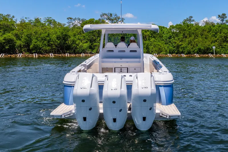  Yacht Photos Pics 2025 Intrepid 41 Panacea boat with triple outboard engines on water.