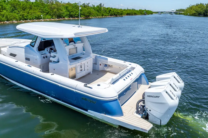  Yacht Photos Pics 2025 Intrepid 41 Panacea boat cruising on a scenic waterway with triple Mercury engines.