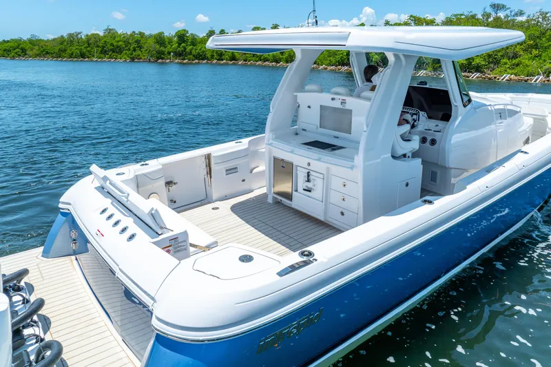  Yacht Photos Pics 2025 Intrepid 41 Panacea boat on water, featuring sleek design and spacious deck.