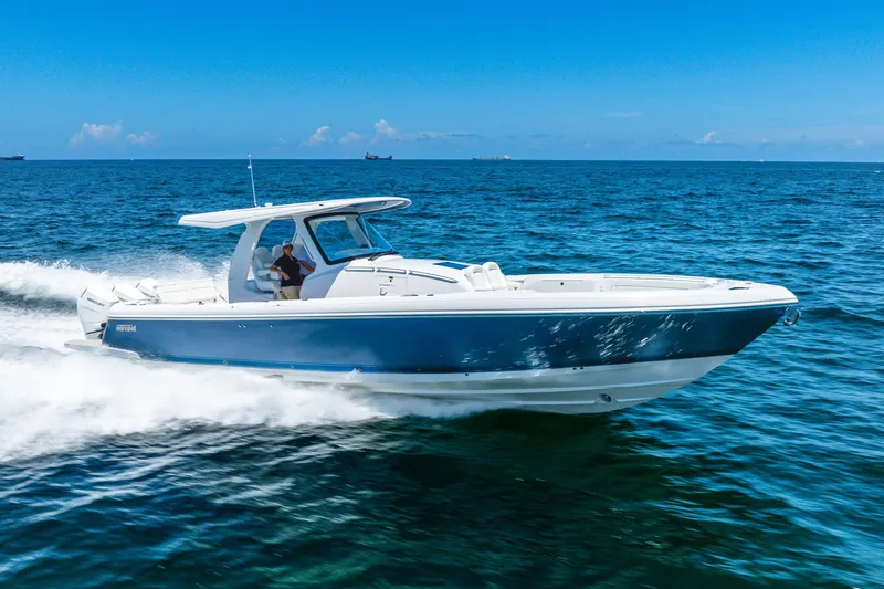  Yacht Photos Pics 2025 Intrepid 41 Panacea cruising on open blue ocean under clear sky.