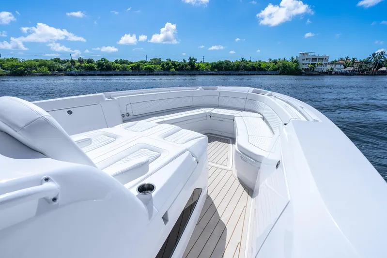  Yacht Photos Pics Luxurious 2025 Intrepid 41 Panacea boat with spacious seating on a sunny day.