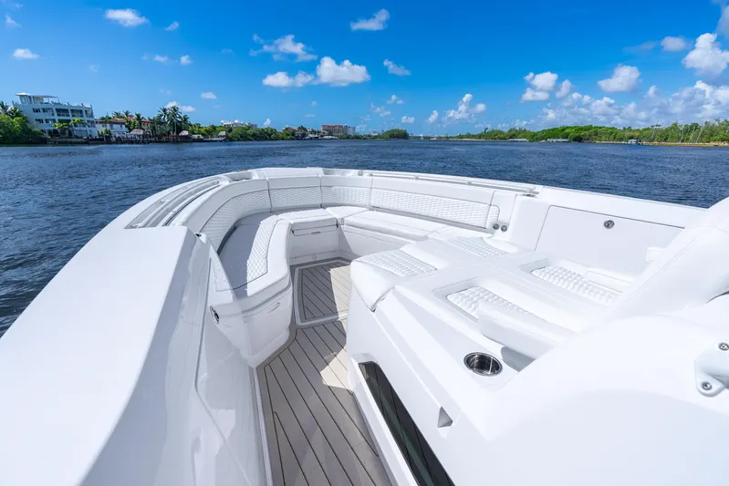  Yacht Photos Pics Luxurious 2025 Intrepid 41 Panacea boat with spacious seating on a sunny day.