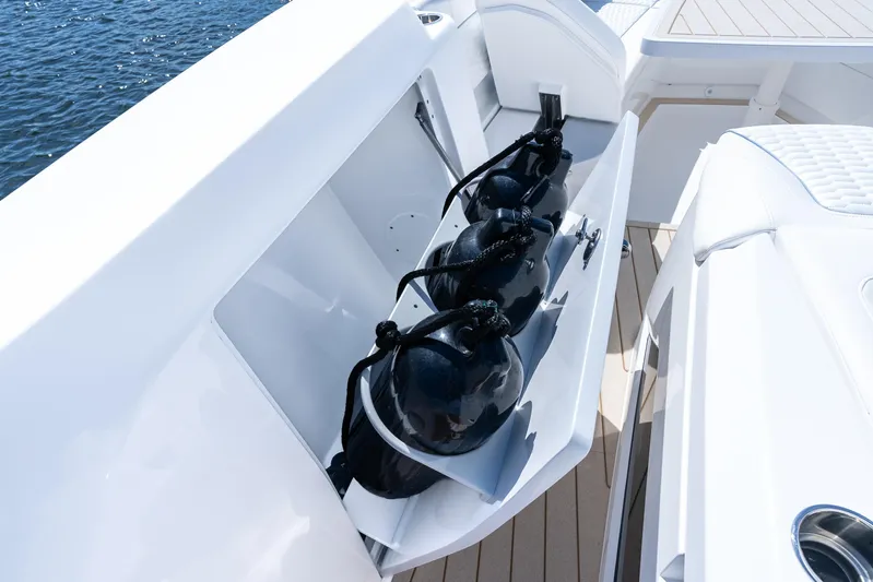  Yacht Photos Pics Storage compartment on 2025 Intrepid 41 Panacea boat with black fenders.
