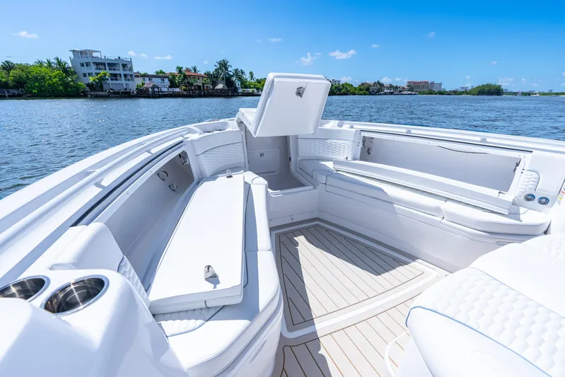  Yacht Photos Pics Luxurious 2025 Intrepid 41 Panacea boat interior with spacious seating and scenic waterfront view.