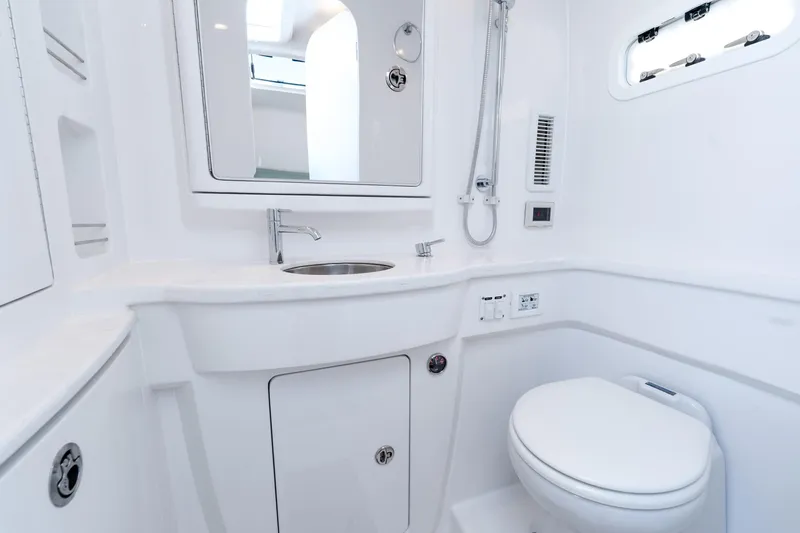  Yacht Photos Pics Luxurious bathroom interior of 2025 Intrepid 41 Panacea yacht, featuring modern fixtures and sleek design.