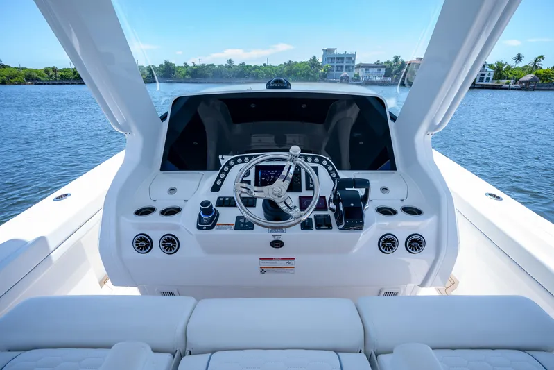  Yacht Photos Pics Helm of 2025 Intrepid 41 Panacea yacht with modern controls and scenic water view.