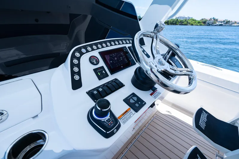  Yacht Photos Pics Helm of 2025 Intrepid 41 Panacea boat with modern controls and steering wheel.