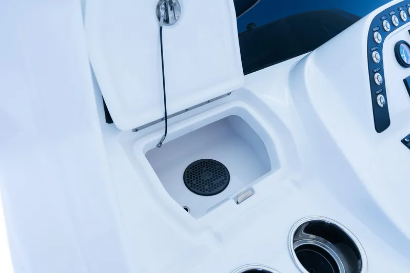  Yacht Photos Pics 2025 Intrepid 41 Panacea boat console with open compartment and control panel.