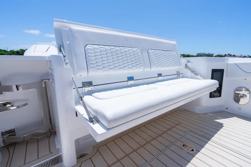  Yacht Photos Pics 2025 Intrepid 41 Panacea boat with foldable white seating on deck.