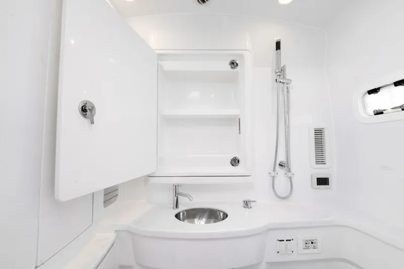  Yacht Photos Pics Luxurious bathroom interior of 2025 Intrepid 41 Panacea yacht with modern fixtures.