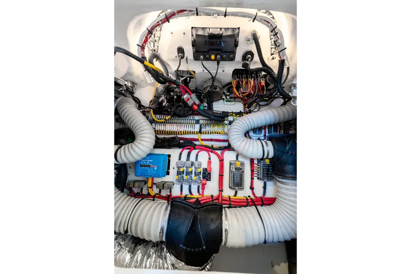  Yacht Photos Pics Engine compartment of 2025 Intrepid 41 Panacea, showcasing complex wiring and components.