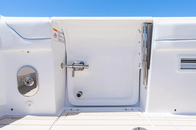  Yacht Photos Pics 2025 Intrepid 41 Panacea boat hatch detail against clear blue sky.