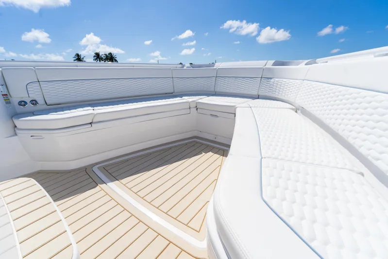  Yacht Photos Pics Luxurious seating on 2025 Intrepid 41 Panacea boat under clear blue sky.