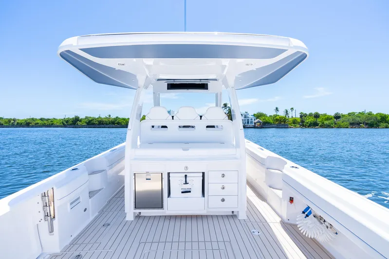  Yacht Photos Pics 2025 Intrepid 41 Panacea boat interior with sleek design on calm water.