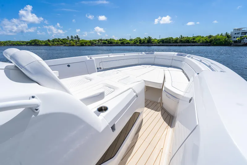  Yacht Photos Pics Luxurious 2025 Intrepid 41 Panacea boat with spacious seating on a sunny day.