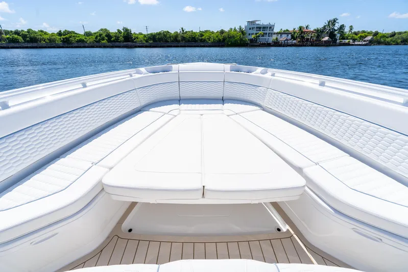  Yacht Photos Pics Luxurious seating area on 2025 Intrepid 41 Panacea boat, with scenic water view.