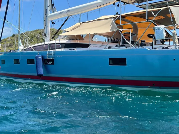 Hindsight Yacht Photos Pics 2016 Jeanneau 64 sailboat on clear blue water.