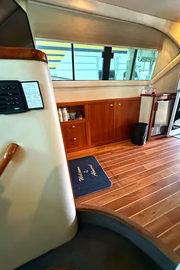 Tracy II Yacht Photos Pics Interior of 2002 Riviera 350 yacht with wooden flooring and cabinetry.